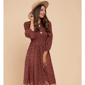 Red brown dress with floral pattern and smocked top. Like new, worn only once